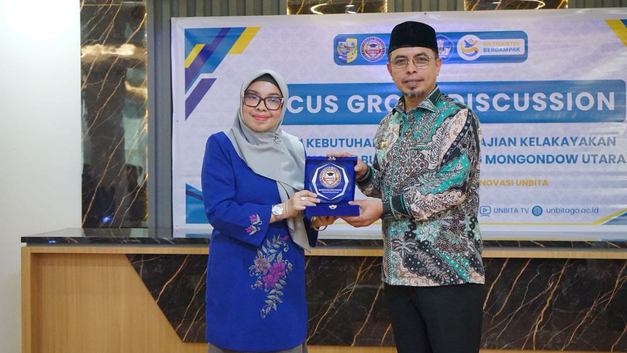 Bupati Bolaang Mongondow Utara, Dr. Sirajudin Lasena, S.E., M.Ec.Dev dan Rektor UNBITA Gorontalo, Dr. Ellys Rachman, M.Si